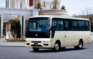 Civilian Bus in front of mansion 